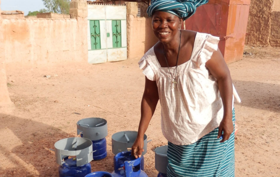 woman posing beside canisters