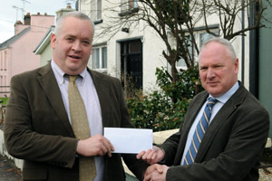 Michael Keogh of Flogas Ireland presenting a €500 cheque to Dr John Griffin, president of the SVP Ballyhaunis Conference, on Tues 26 November in Ballyhaunis.