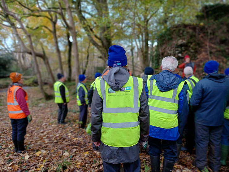 Men's Shed members with Flogas sponsored gear receiving instructions for rhododendron clearing at Killarney National Park